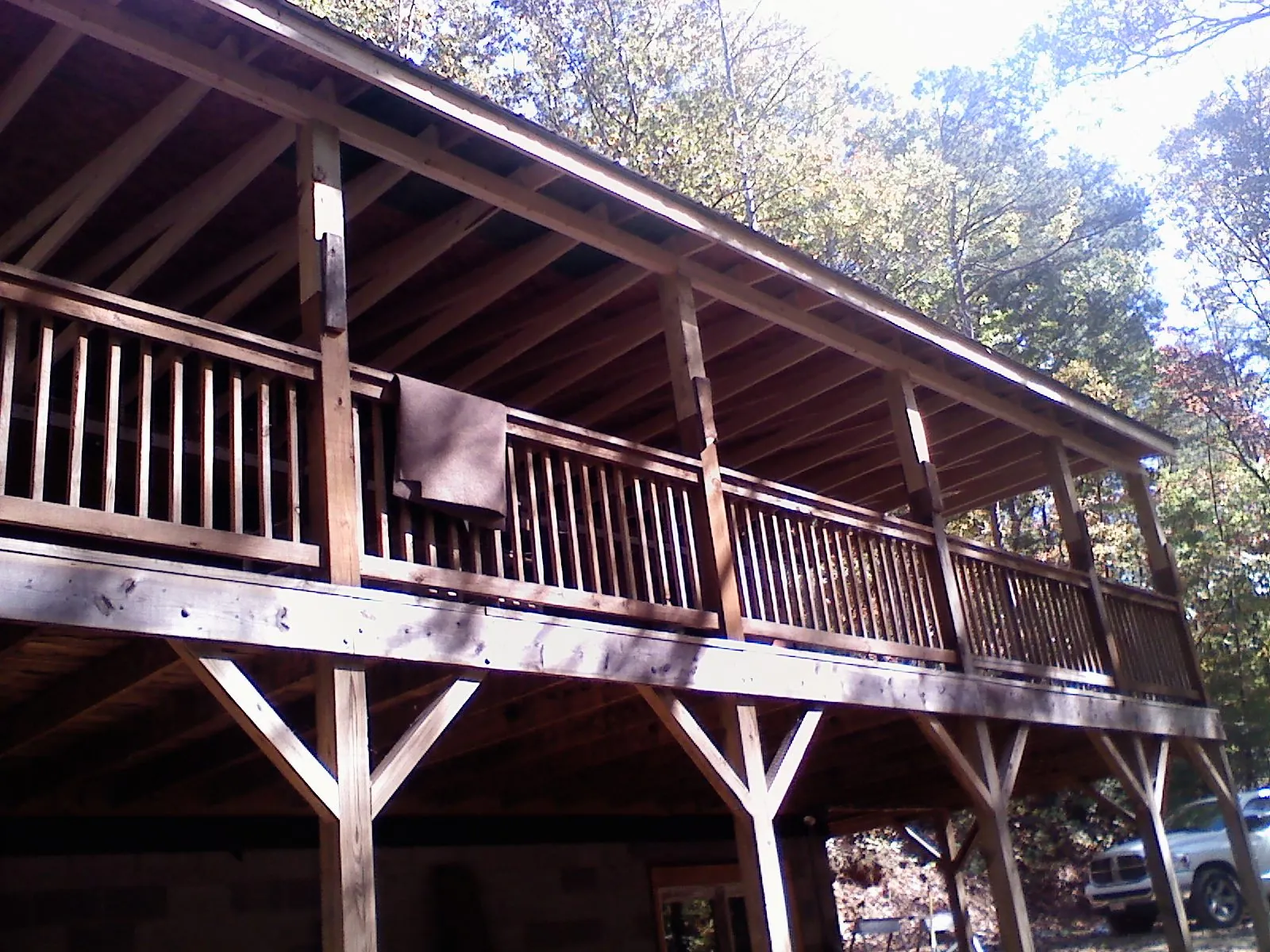 Timber framing under a new elevated porch and deck — Roof Leak Repair in Wake by Roofing Brothers